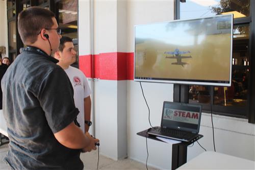 students on an airplane simulator 